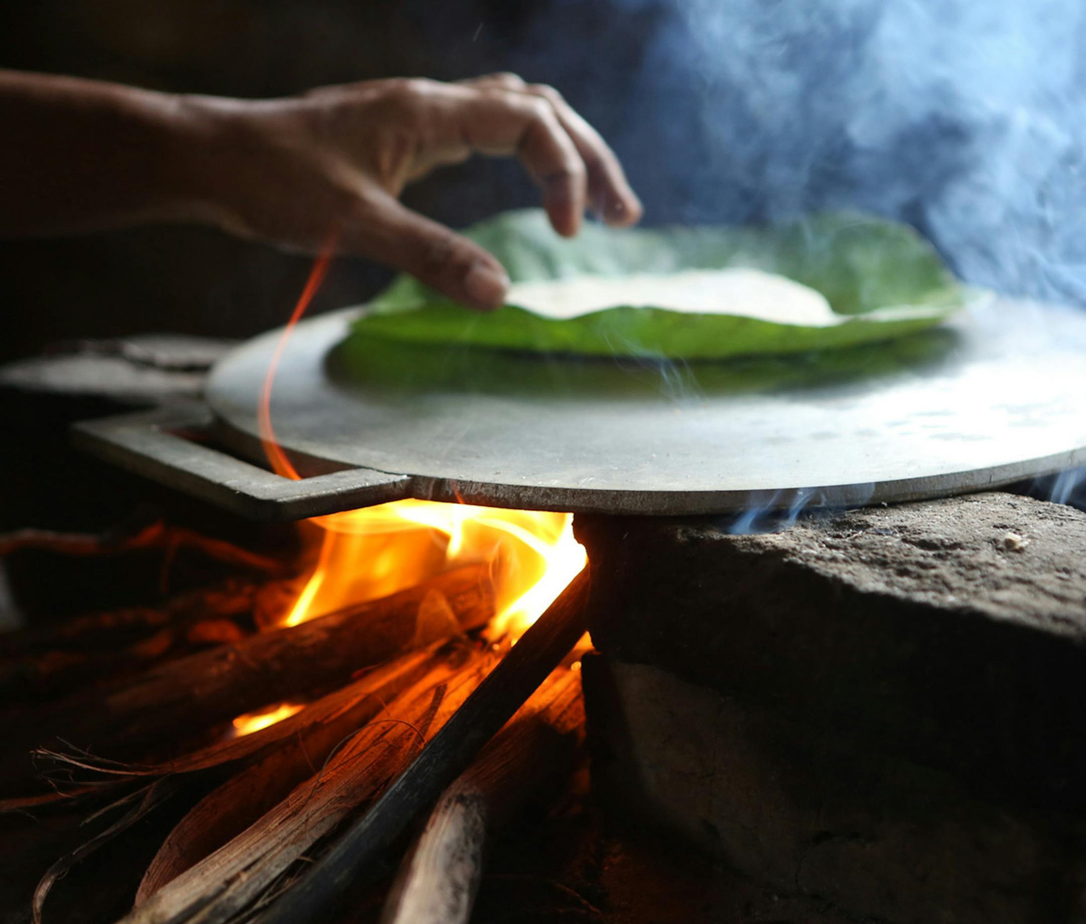 Photo by Mirra Fine, the Perennial Plate Sri Lanka: Coconut roti being baked on a hot plate
