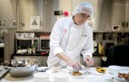 Thomas Dickens, Chef Services development leader at Hormel, shows some new products in the company's test kitchen at their headquarters on Sept. 15, 2