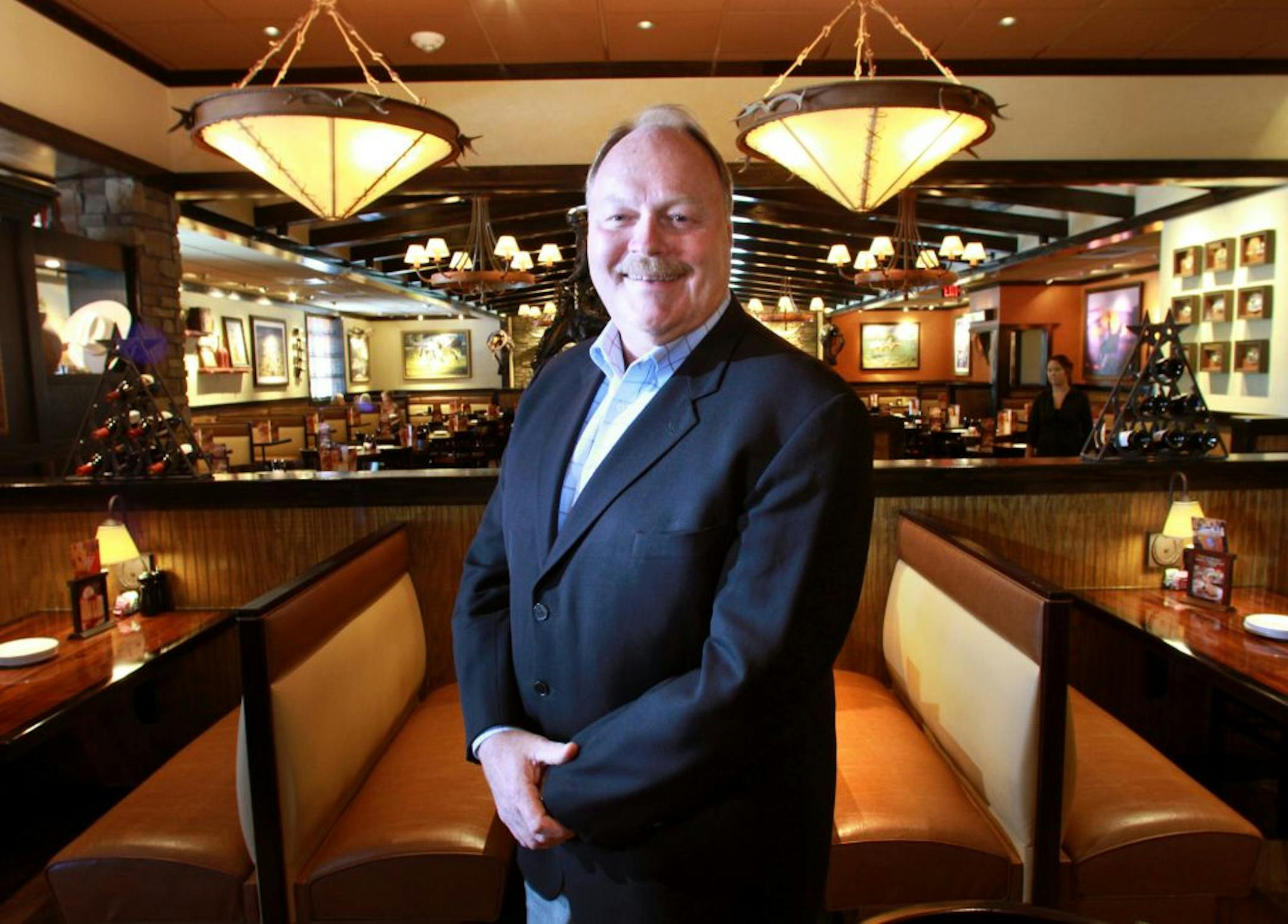 LongHorn Steakhouse president Dave George poses for portrait at the Darden chain&apos;s newest location on Vineland Avenue in Orlando, Florida, July 29, 2011.