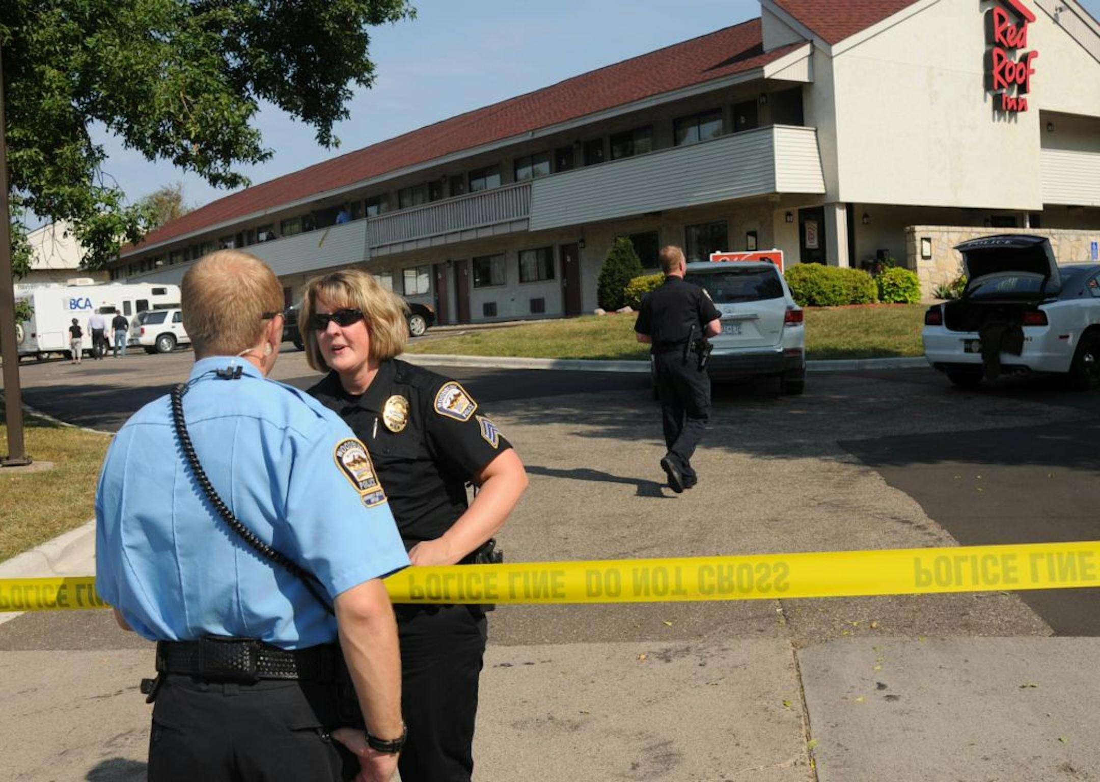 A standoff with police involving numerous hostages at a Red Roof Inn near Interstate 494 and Valley Creek Road left one man shot to death by police and another under arrest, authorities said.
