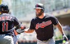 The Indians' Mike Napoli, right
