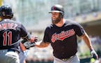 The Indians' Mike Napoli, right