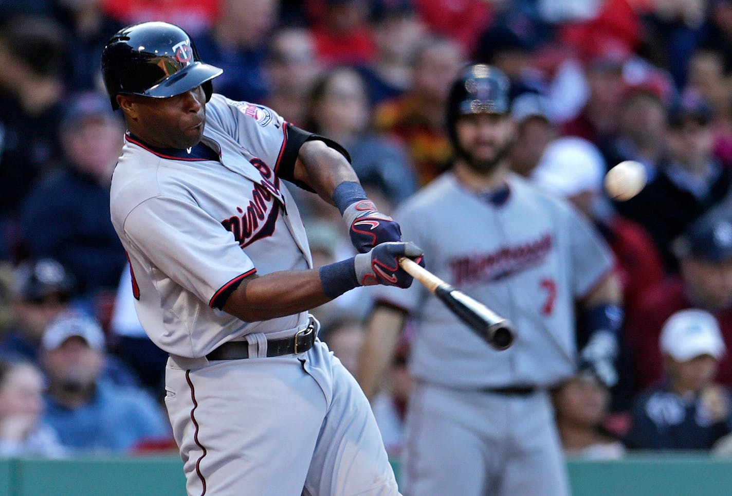 Minnesota Twins right fielder Torii Hunter connects for a three run home run off Boston Red Sox starting pitcher Steven Wright in the fifth inning during a baseball game at Fenway Park in Boston, Thursday, June 4, 2015. (AP Photo/Charles Krupa)