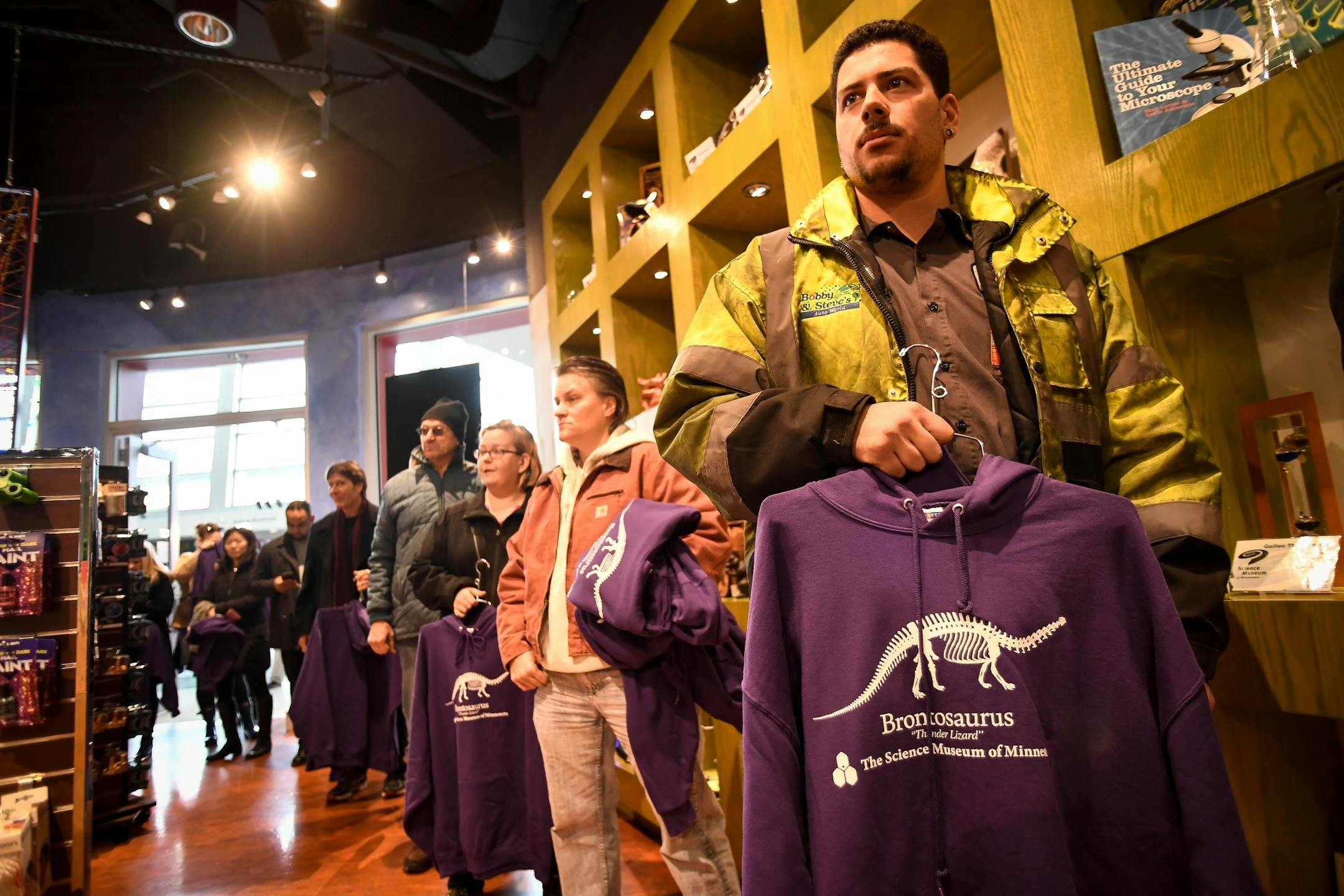 Jeremy Smith, of St. Paul, was among one of the first people to arrive at the Science Museum of Minnesota gift shop Tuesday morning to purchase the brontosaurus hoodie made popular by Stranger Things.