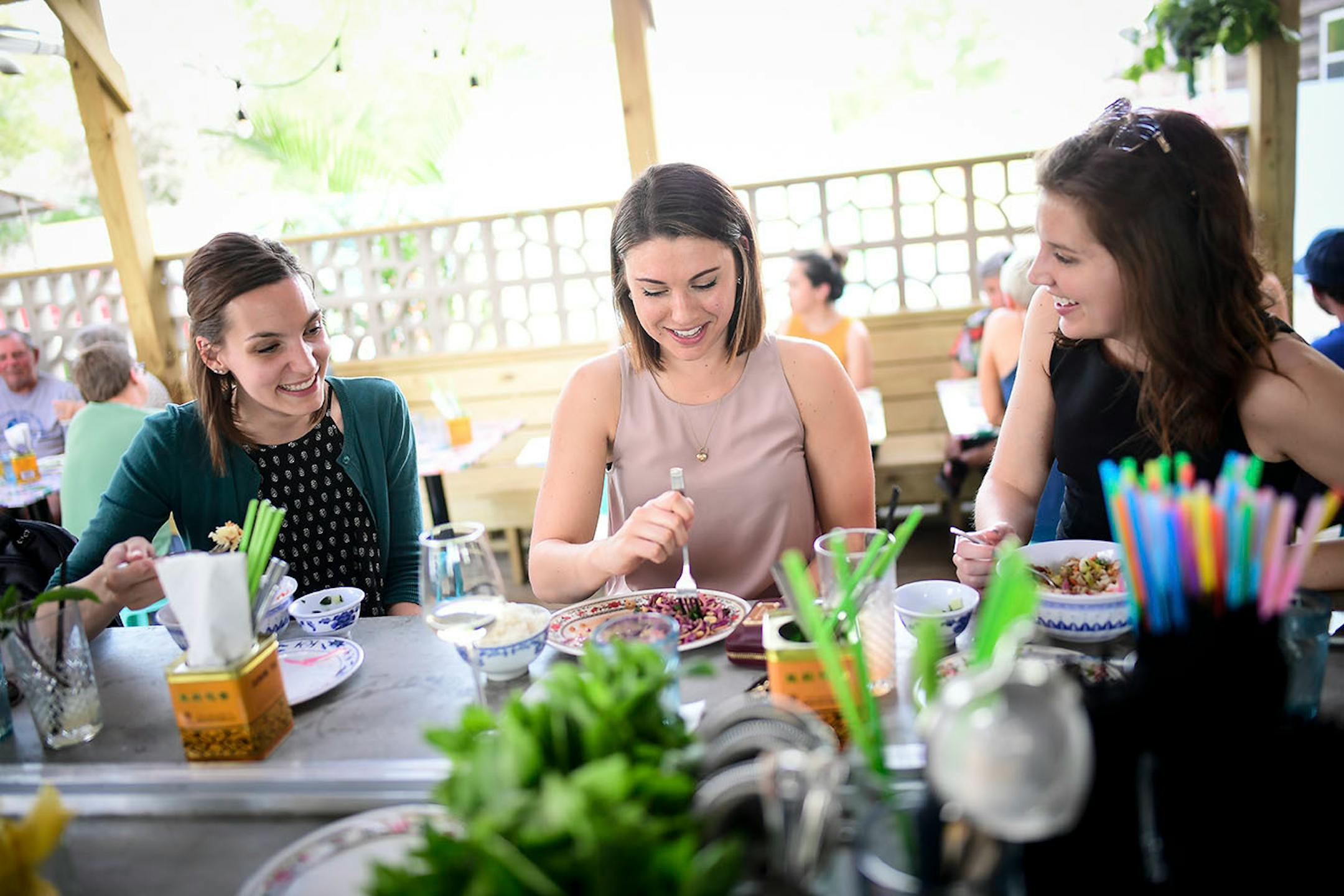 From left, Margo Goodman, of Woodbury, Kate Faust, of Northeast, and Hillary Schuler, of Edina, grabbed food and drinks Thursday afternoon at Hai Hai's patio bar.