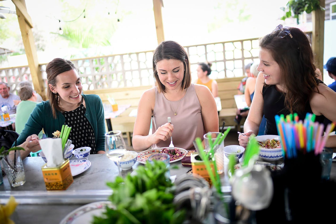 From left, Margo Goodman, of Woodbury, Kate Faust, of Northeast, and Hillary Schuler, of Edina, grabbed food and drinks Thursday afternoon at Hai Hai's patio bar.