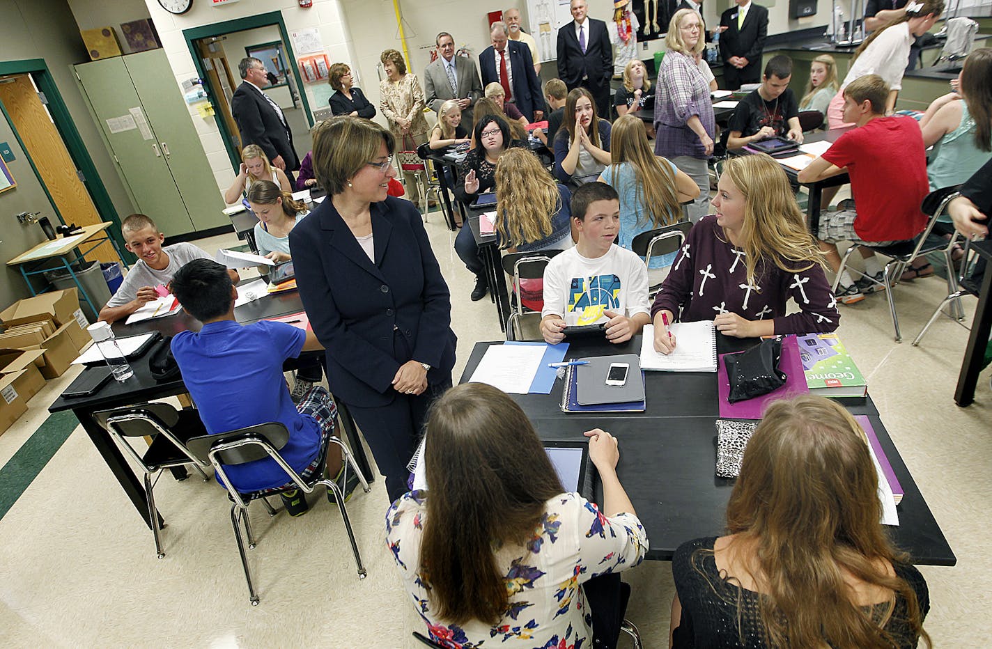 Sen. Amy Klobuchar and other community leaders visited a Biology class that were learning to use their new ipads at Waconia Senior High School, Wednesday, September 4, 2013. A new fiber optic broadband system was dedicated at Waconia Senior High School. It will connect 86 community organizations in Carver County. Most of the $7 million project came from federal funds, and features an 89-mile underground fiber ring that will link all 11 cities in the county. (ELIZABETH FLORES/STAR TRIBUNE) ELIZAB