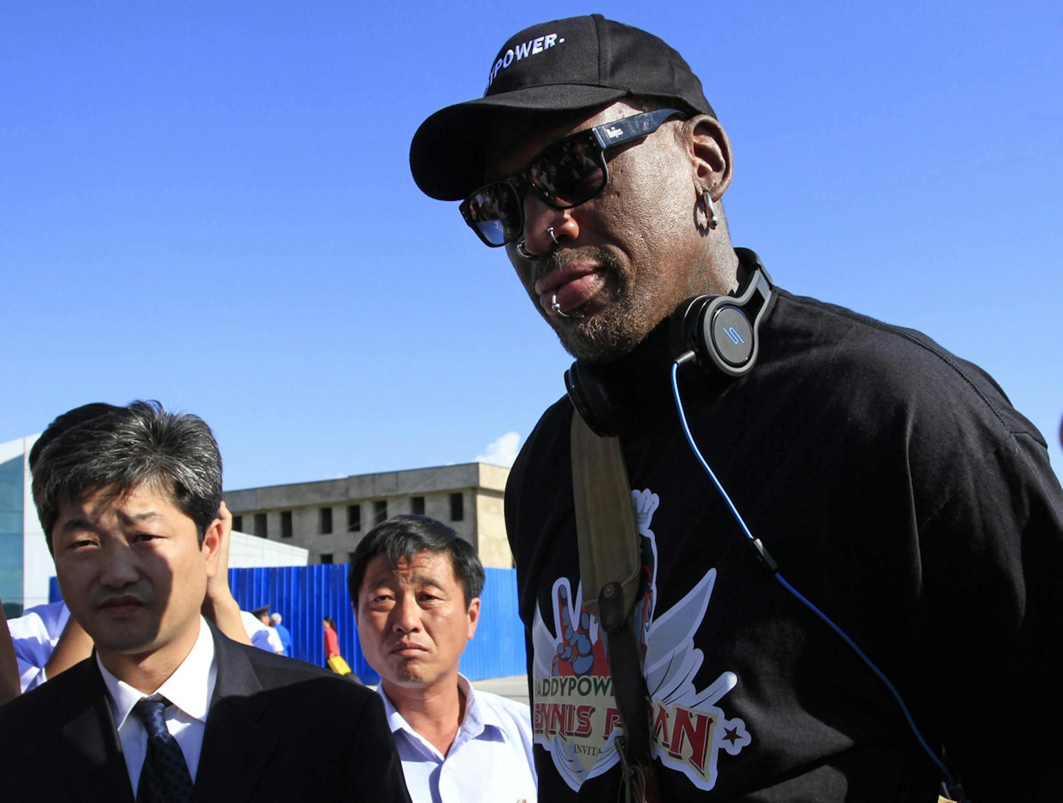 Former NBA star Dennis Rodman arrives at Pyongyang airport, North Korea, Tuesday, Sept. 3, 2013.