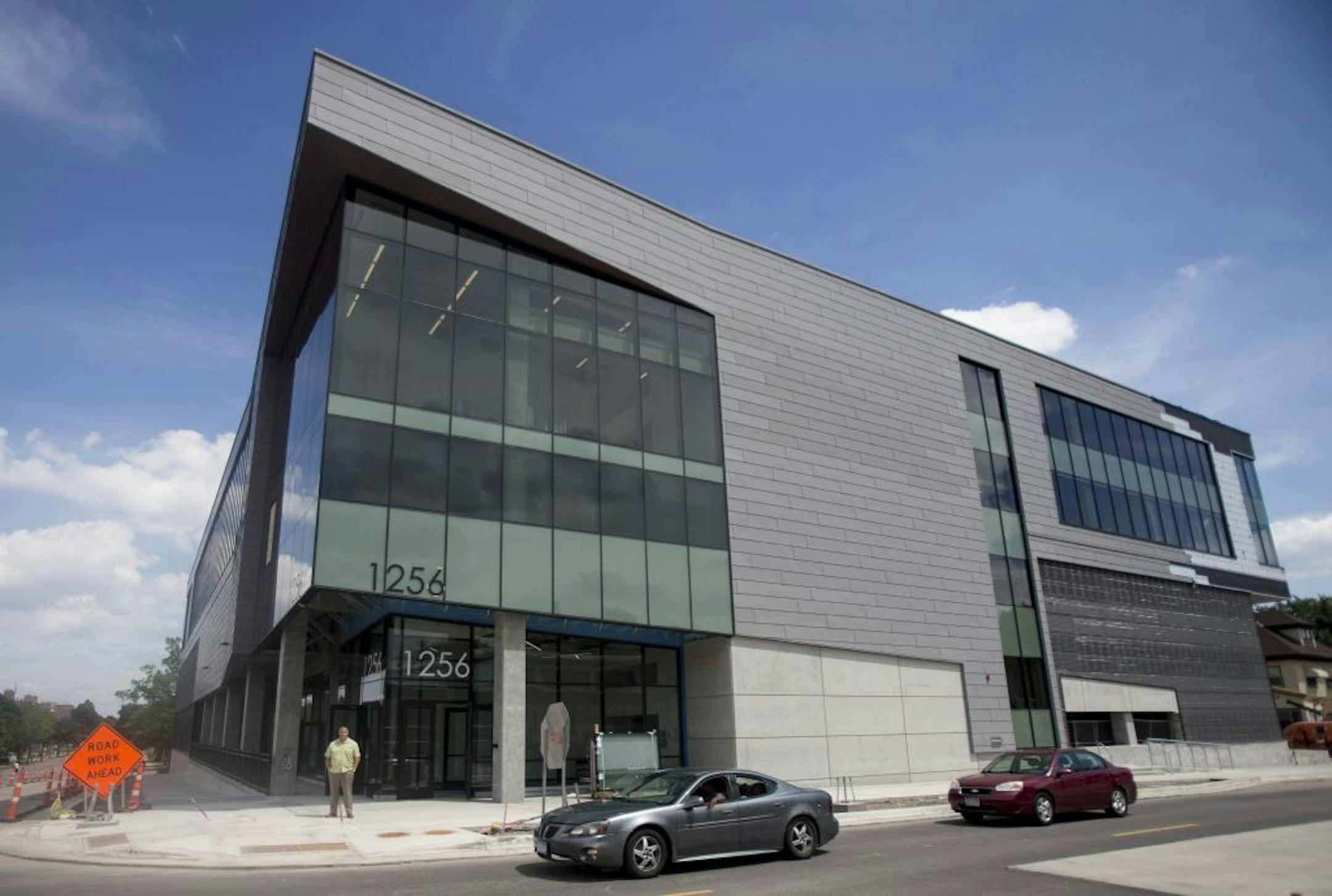 Ravi Norman, THOR Companies CEO, posed for a portrait in front of the building that will soon be the company's new headquarters.