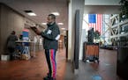 Victor Gaten filled out his ballot application Wednesday at the Hennepin County Government Center. ] GLEN STUBBE • glen.stubbe@startribune.com Wedne