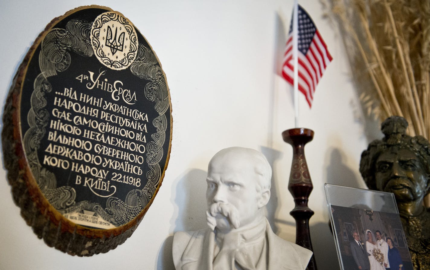 In Michael's office hang the Declaration of Ukrainian Independence, left, a bust of famous Unrainian poet Taras Shevchenko and a U.S. flag.