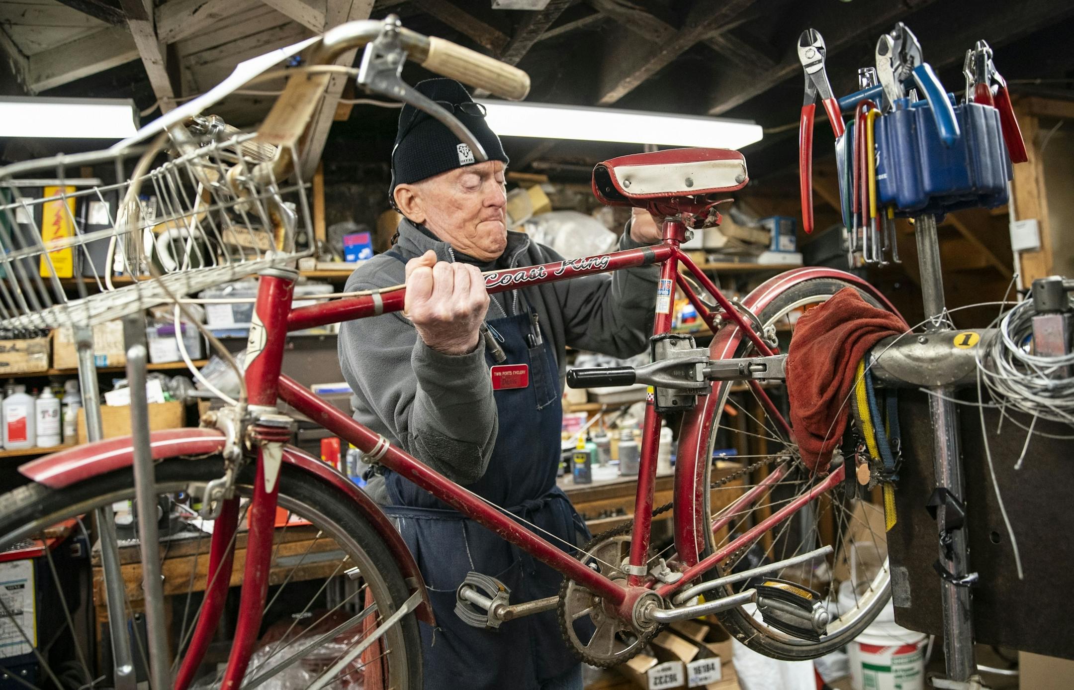Denis Sauve, co-owner of Twin Ports Cyclery, mounted a bike to begin repairing it on Friday afternoon.