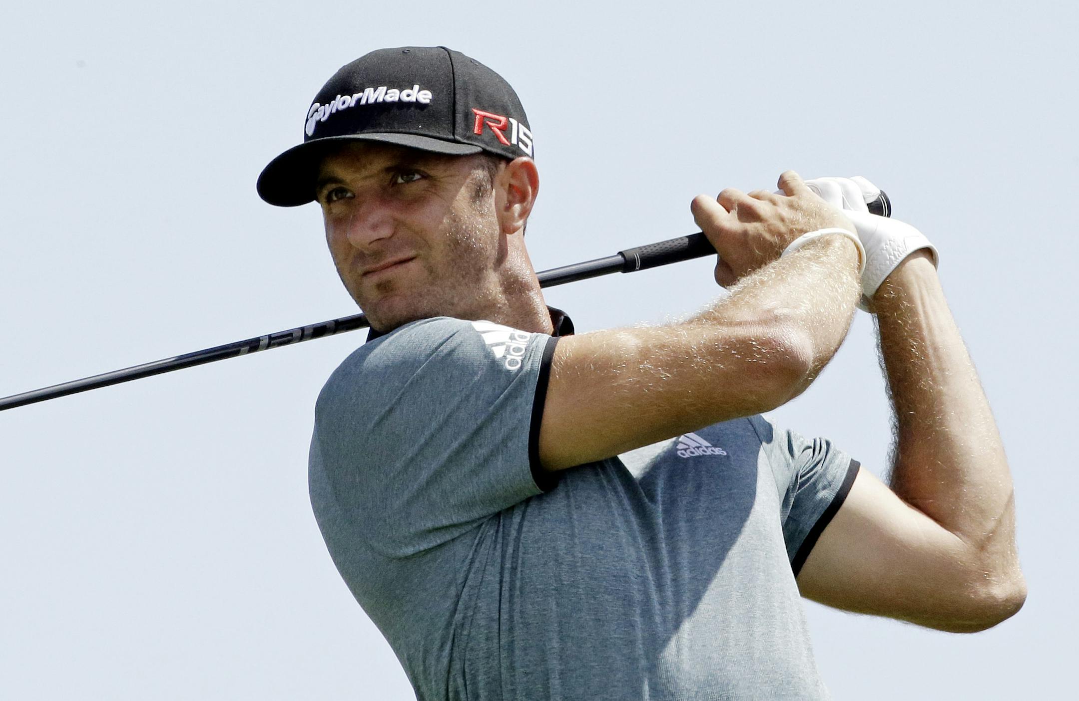 Dustin Johnson hits on the 11th hole during a practice round for the PGA Championship golf tournament Tuesday, Aug. 11, 2015, at Whistling Straits in Haven, Wis. (AP Photo/Brynn Anderson)