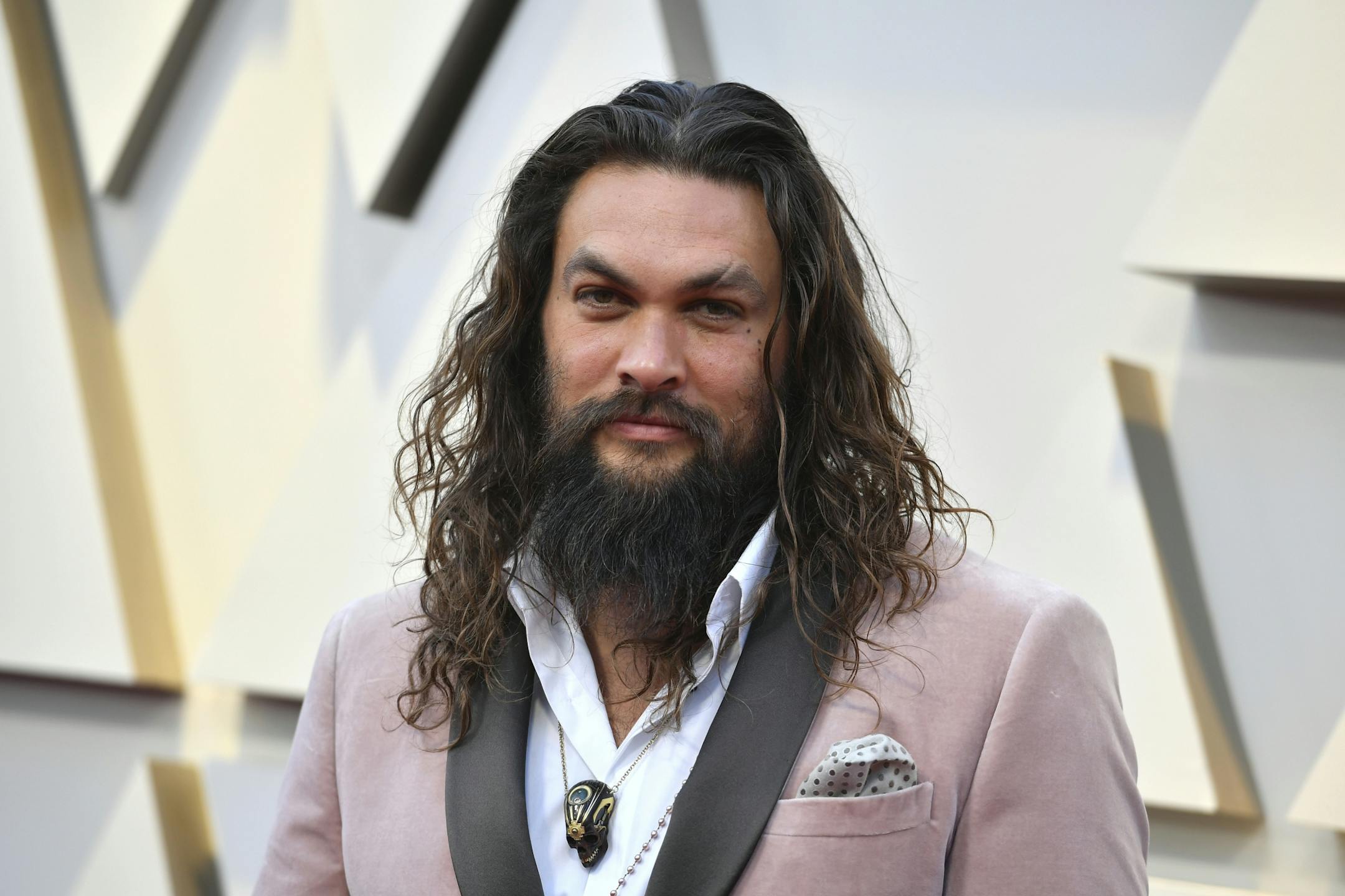 Jason Momoa arrives at the Oscars on Sunday, Feb. 24, 2019, at the Dolby Theatre in Los Angeles.
