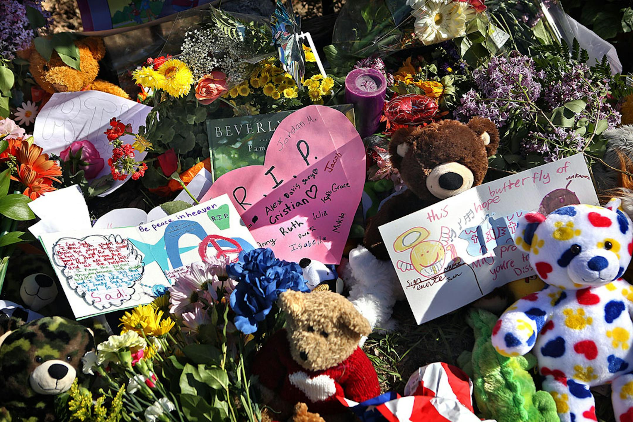 May 2013: Students, parents and staff have placed a variety of mementos, including heartfelt notes, stuffed animals and flowers, at the makeshift memorial at Peter Hobart Elementary School.