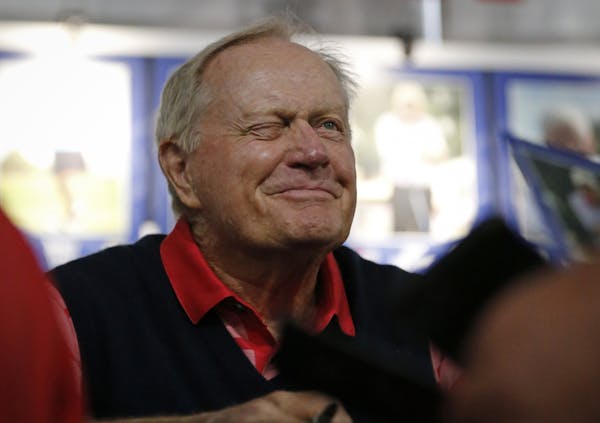 Golf legend Jack Nicklaus winked at a fan after signing an autograph at the 3M Championship at the TPC in Blaine, Minn.