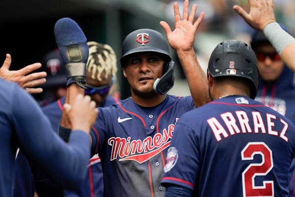 Minnesota Twins[ Jermaine Palacios (87) celebrates after scoring against the Detroit Tigers in the seventh inning of the first game of a baseball doub