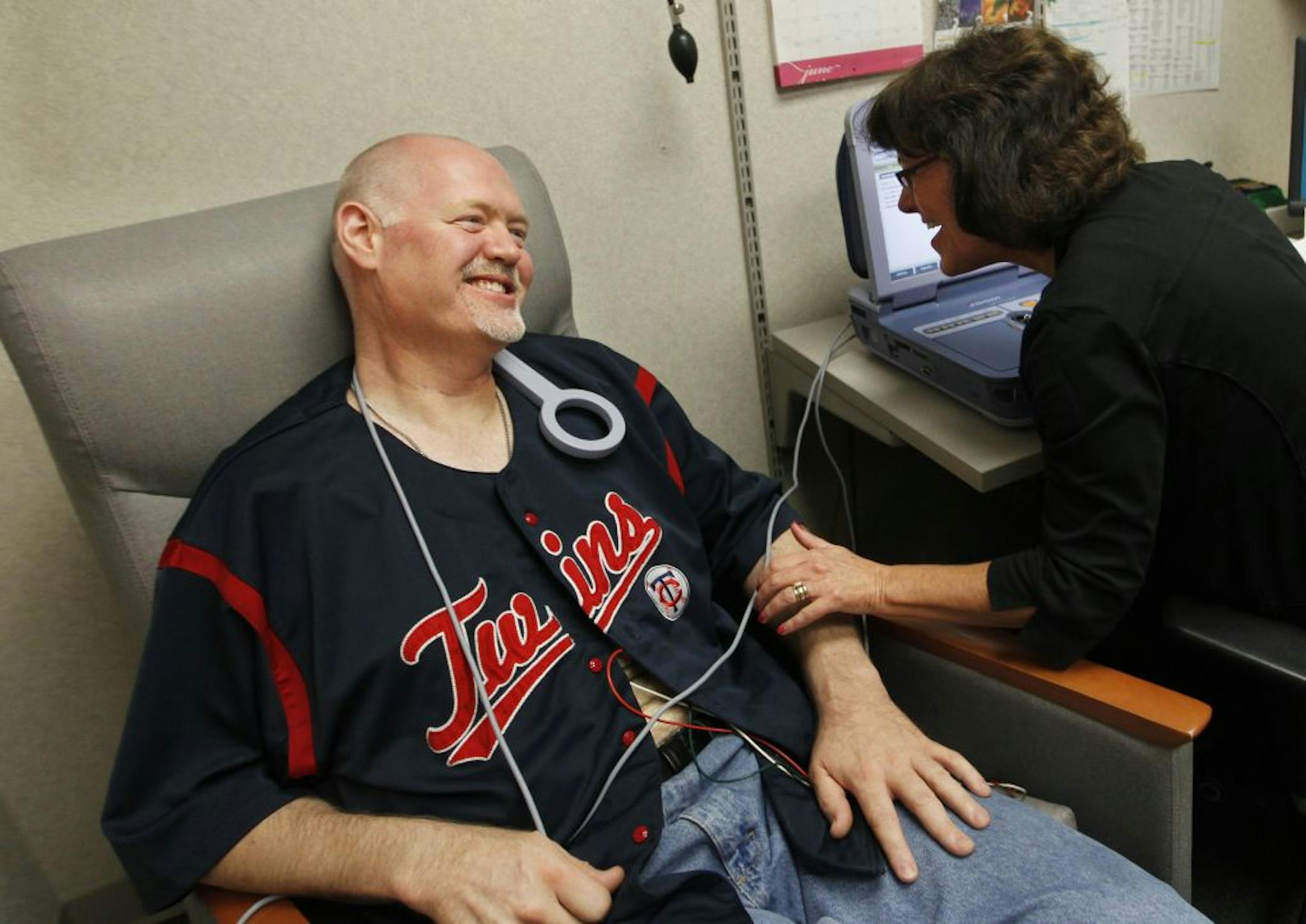 At the Edina Heart clinic, patient Brian Kruger had data downloaded from his pacemaker/defibrillator by nurse Deb Dempsey. Kruger suffered a cardiac event where his heart raced to about 300 beats per minute and he passed out. The defibrillator kicked in and reset his heart.