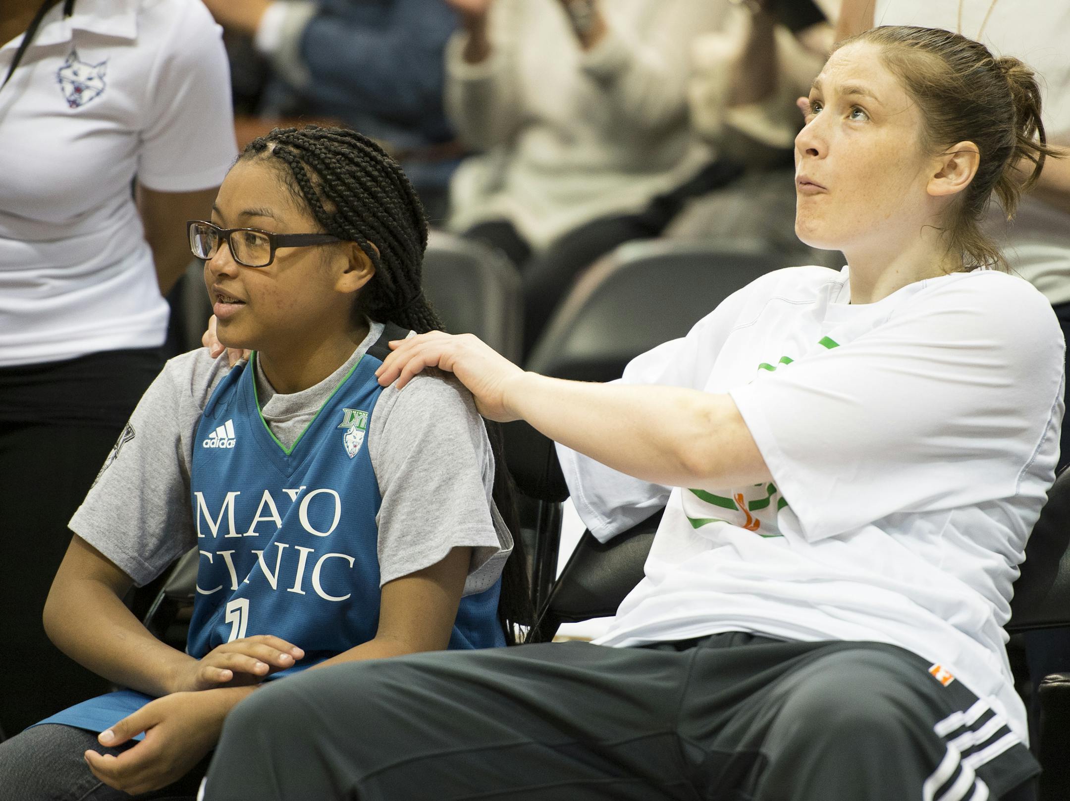 Minnesota Lynx guard Lindsay Whalen rubbed the shoulders of Ariya Smith, a 14-year-old from Colorado suffering from systemic lupus, before Thursday night's Lynx game against the Seattle Storm. ] Aaron Lavinsky • aaron.lavinsky@startribune.com The Minnesota Lynx play the Seattle Storm on Thursday, June 11, 2015 at Target Center in Minneapolis, Minn. ORG XMIT: MIN1506112000300765