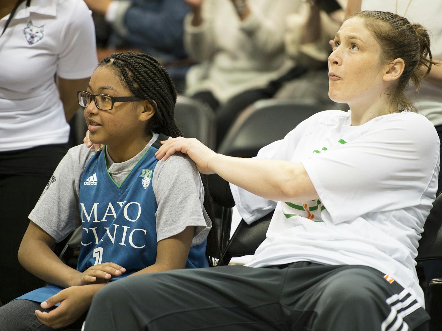 Minnesota Lynx guard Lindsay Whalen rubbed the shoulders of Ariya Smith, a 14-year-old from Colorado suffering from systemic lupus, before Thursday night's Lynx game against the Seattle Storm. ] Aaron Lavinsky &#x2022; aaron.lavinsky@startribune.com The Minnesota Lynx play the Seattle Storm on Thursday, June 11, 2015 at Target Center in Minneapolis, Minn. ORG XMIT: MIN1506112000300765