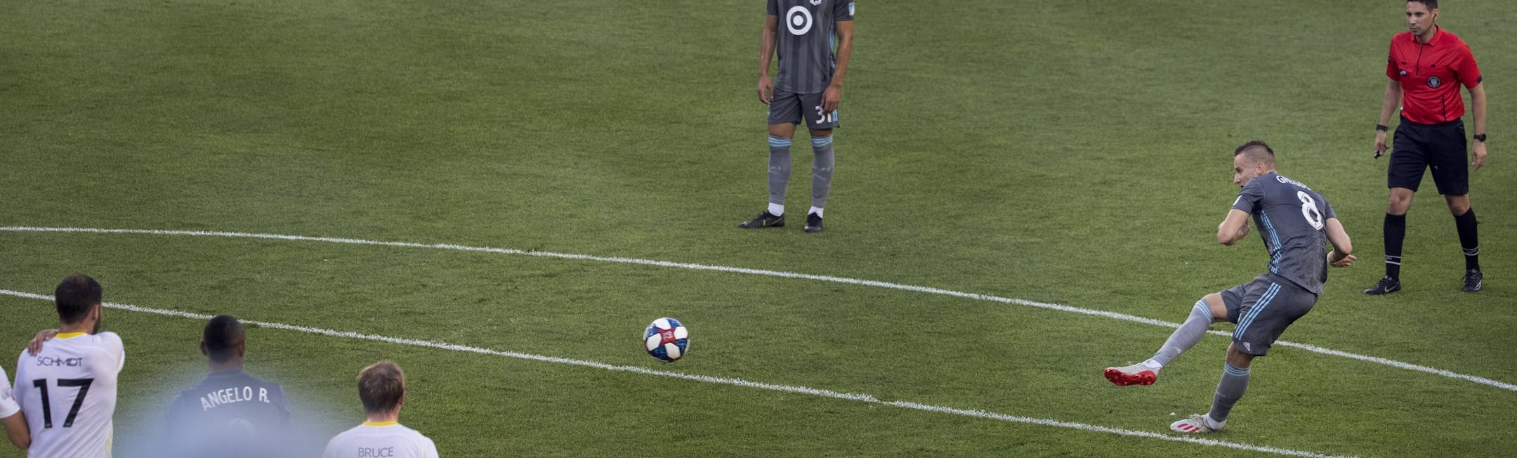 Jan Gregus (8) shot the ball past defenders for a goal in the first half.