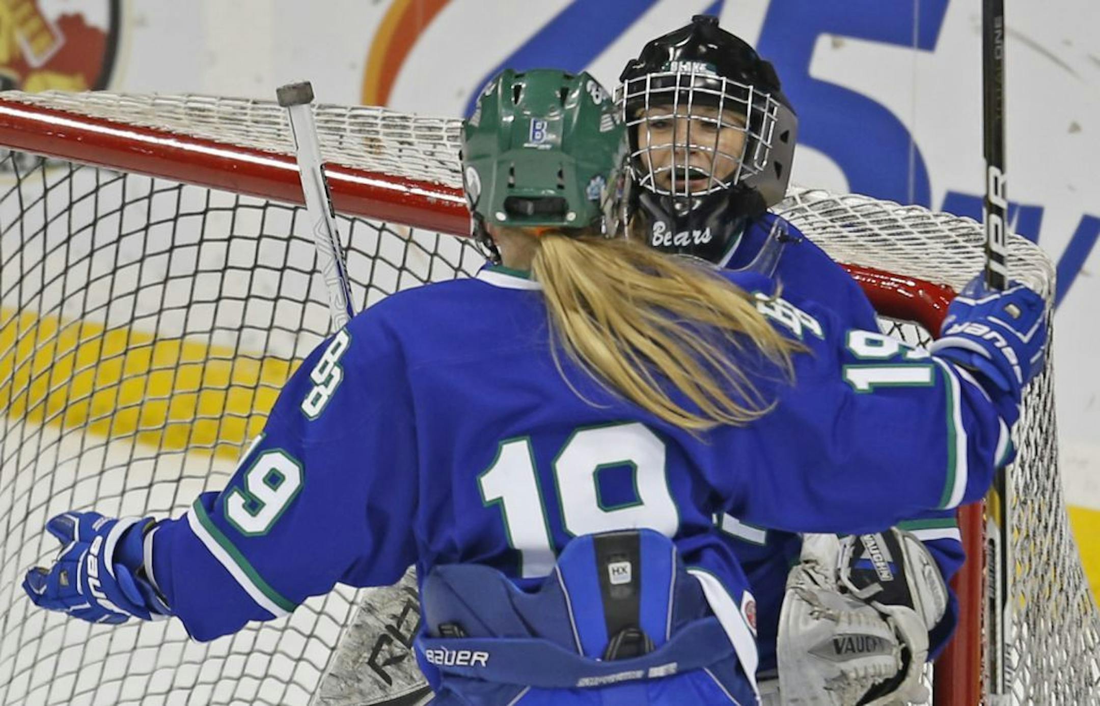 Blake's Kate Fraley and Tori Johnson celebrated their Class 1A championship win over Warroad.