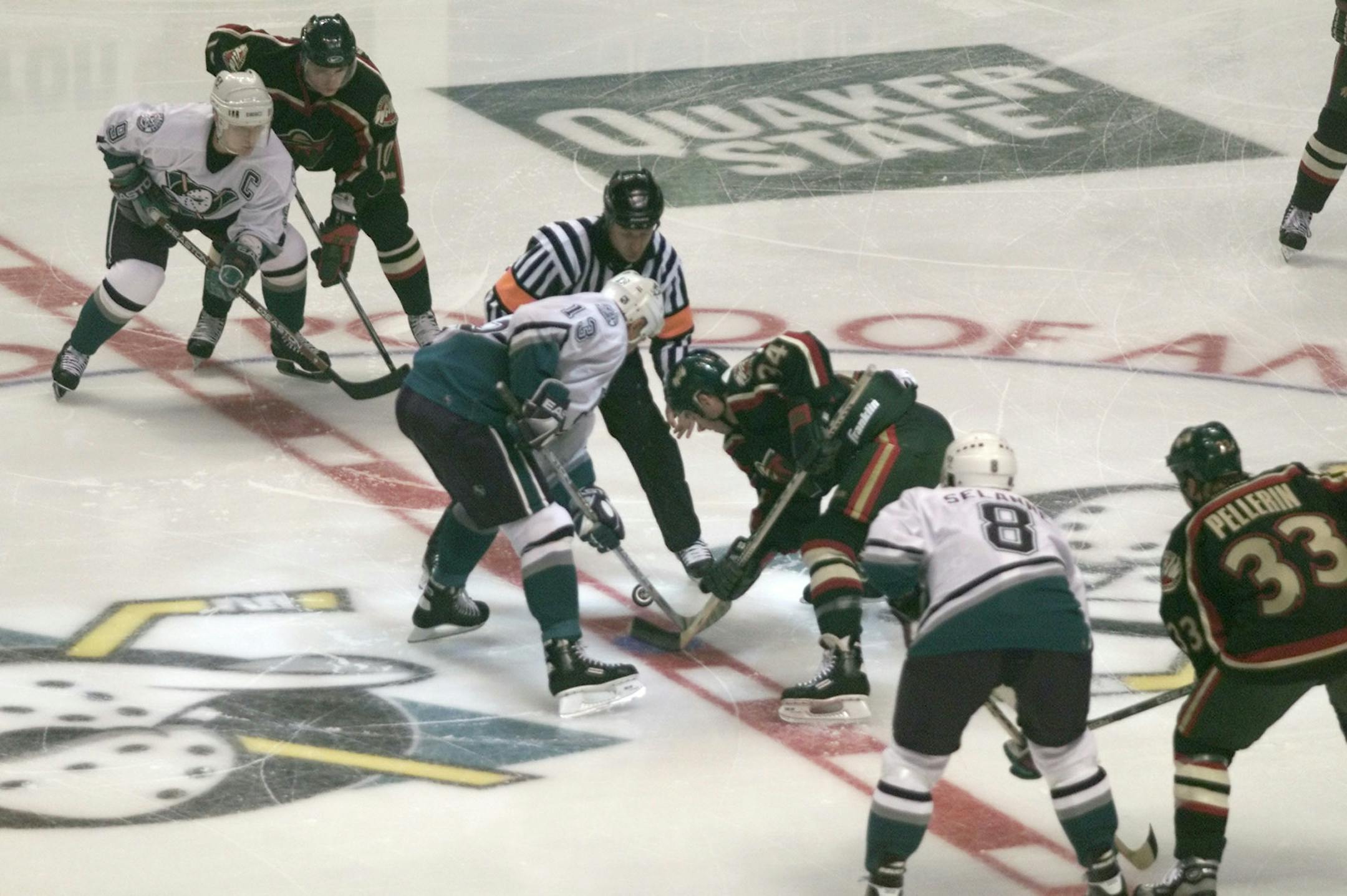 Center Jim Dowd of the Wild took the first faceoff of the first game of the team's first season at the Pond in Anaheim. He faced off against the Mighty Duck's German Titov (13).