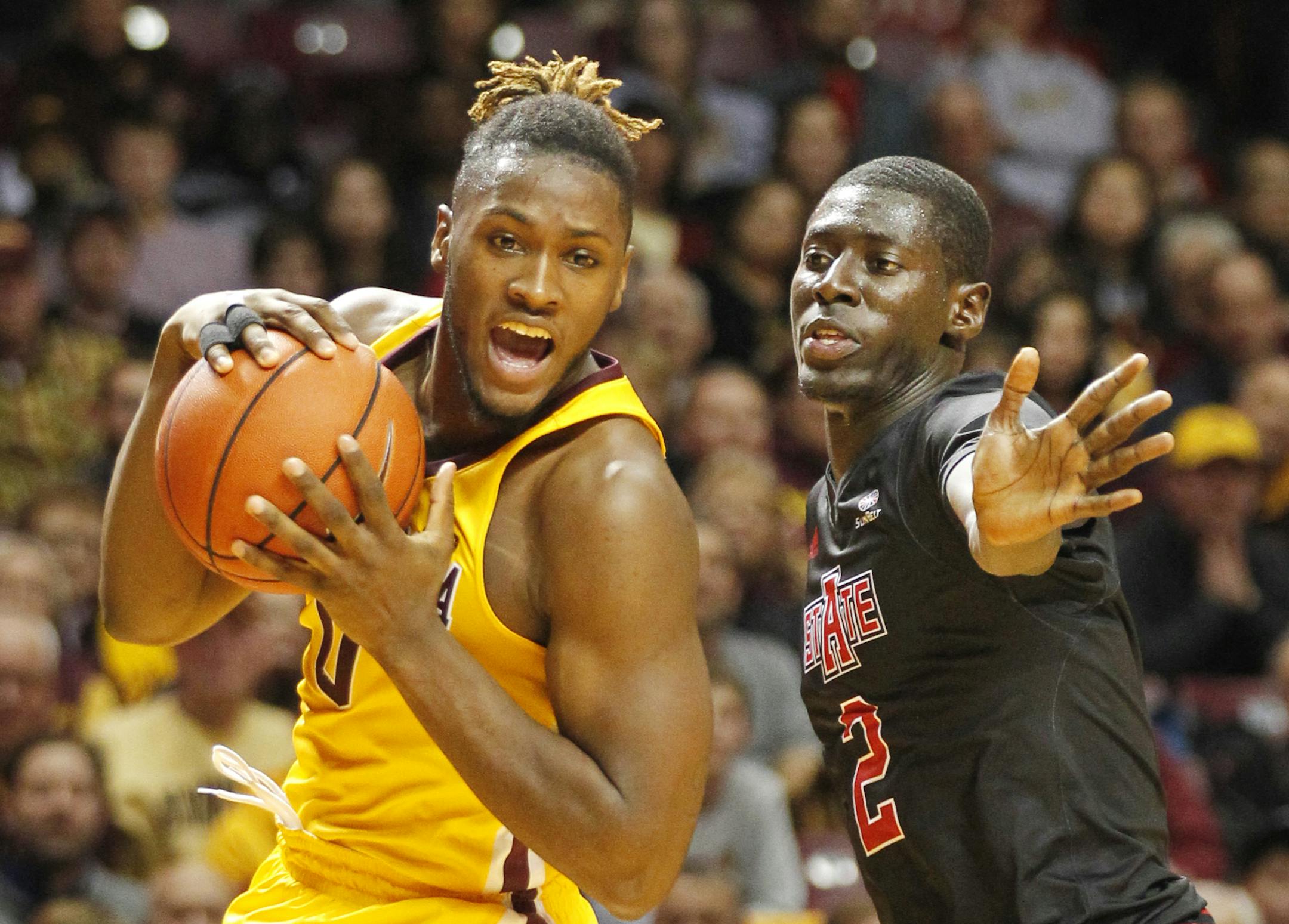 Arkansas State guard Salif Boudie (2) covers Minnesota guard Akeem Springs (0) battle for the ball in the first half of a NCAA college basketball game Friday, Dec. 23, 2016, in Minneapolis.(AP Photo/Andy Clayton-King)