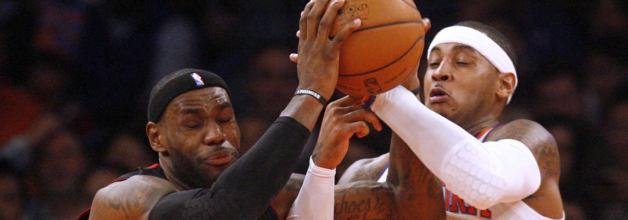 Miami Heat's LeBron James (6) tries to maintain possession while being defended by New York Knicks' Carmelo Anthony (7) during the first half of an NBA basketball game, Friday, Nov. 2, 2012, in New York. (AP Photo/Jason DeCrow) ORG XMIT: NYJD102