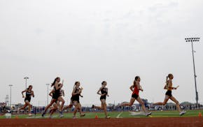Runners compete in the Girls 4x800-meter relay during the Class 2A boys and girls state track and field meet finals at St. Michael-Albertville High Sc