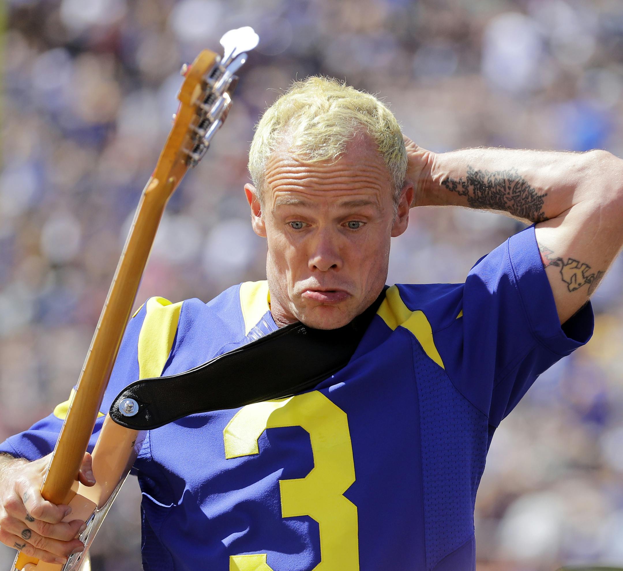 Flea from the The Red Hot Chili Peppers perform prior to an NFL football game between the Los Angeles Rams and the Seattle Seahawks at the Los Angeles Memorial Coliseum, Sunday, Sept. 18, 2016, in Los Angeles. (AP Photo/Jae Hong)