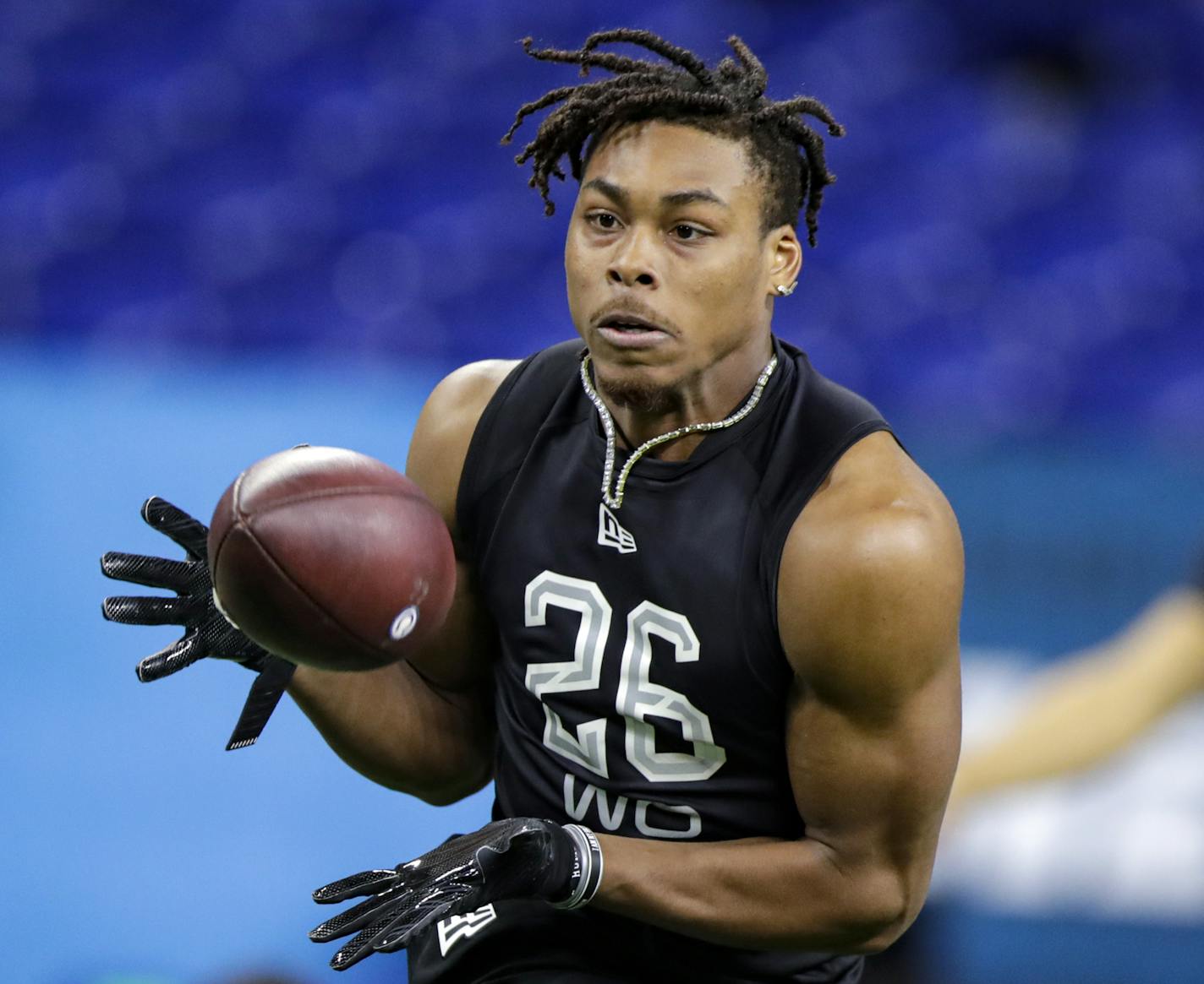 FILE - In this Feb, 27, 2020, file photo, LSU wide receiver Justin Jefferson runs a drill at the NFL football scouting combine in Indianapolis, Thursday, Feb. 27, 2020. Jefferson, the first-round draft pick from LSU, was placed on the reserve/COVID-19 list on Monday, July 27, 2020, with three other Minnesota Vikings players. Teams may not disclose whether player is in quarantine or is positive for COVID-19. (AP Photo/Michael Conroy, File)