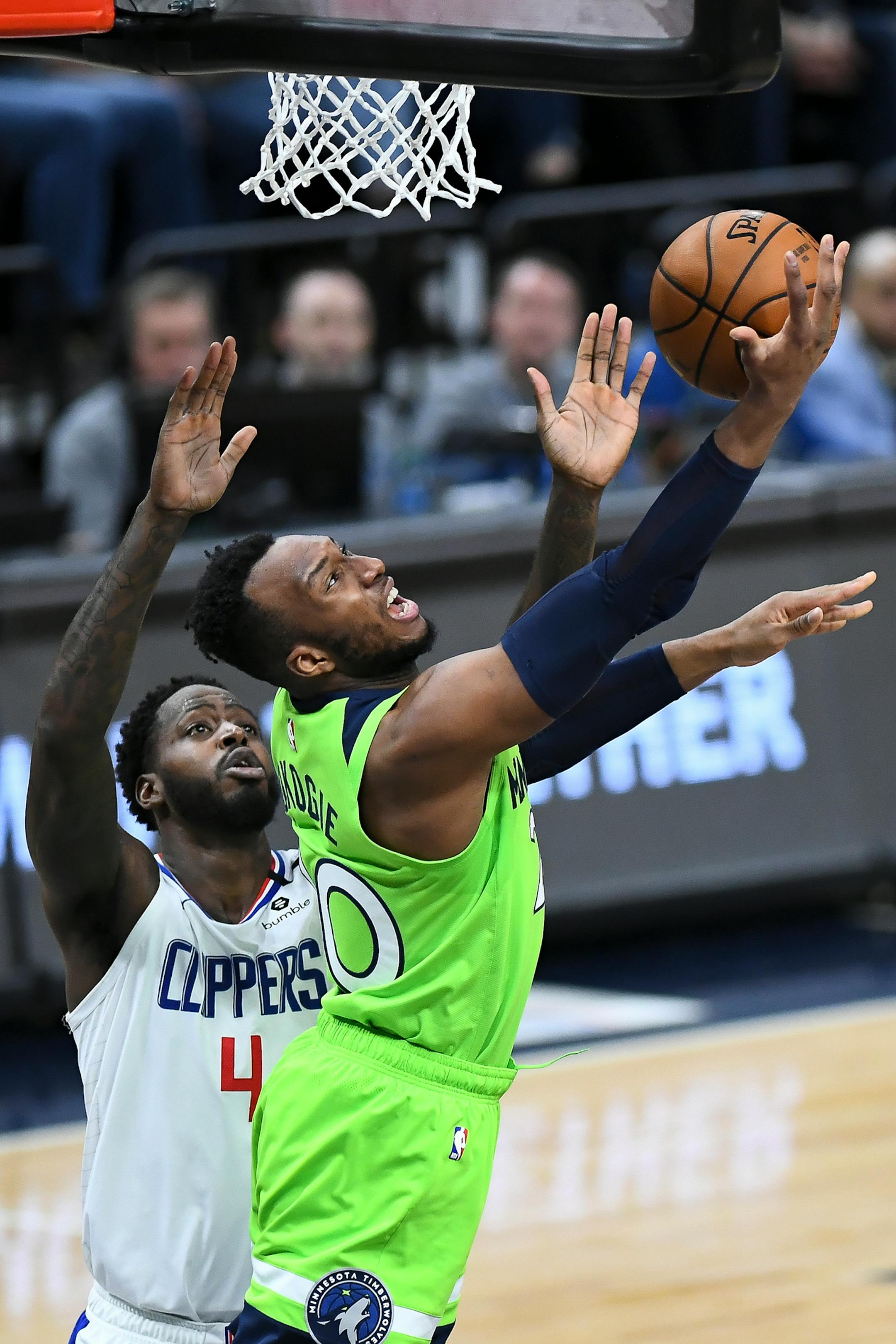 Minnesota Timberwolves guard Josh Okogie (20) attempted a reverse layup but was fouled by LA Clippers guard Isaiah Thomas (4) in the second half.