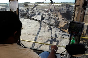 Mosaic Co. operator David Williams works the controls of a phosphate dragline in Tampa, Florida, U.S., on Friday, Dec. 2, 2011. Mosaic Co. is the worl