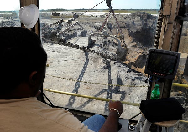 Mosaic Co. operator David Williams works the controls of a phosphate dragline in Tampa, Florida, U.S., on Friday, Dec. 2, 2011. Mosaic Co. is the worl