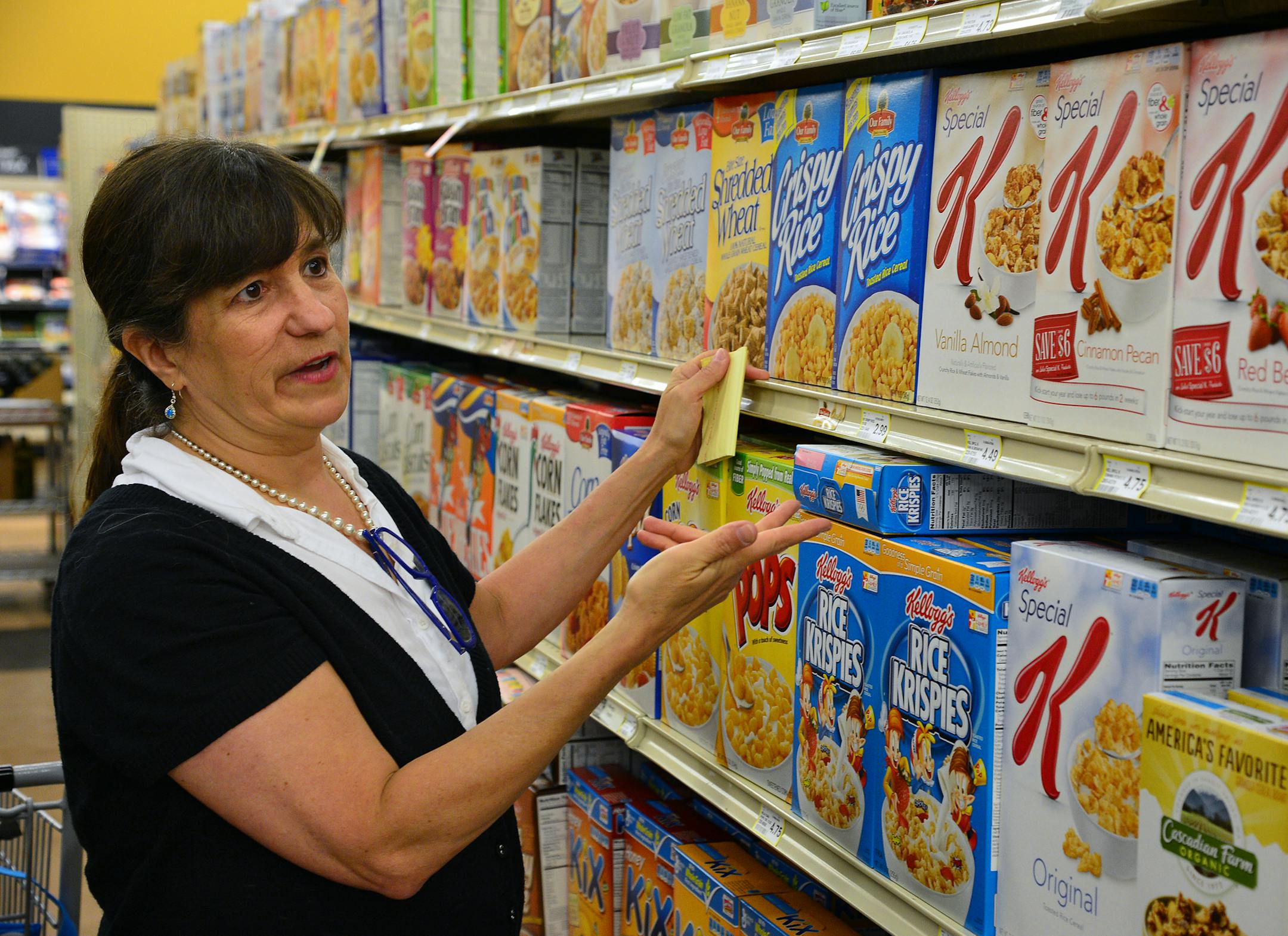 Law Professor Donna Byrne, of William Mitchelll College of Law has studied food labels for years, amassing a trove of them and has some tips for reading them wisely. She looked over the shelves at Oxendale Market for some trends in product labeling] Richard.Sennott@startribune.com Richard Sennott/Star Tribune Minneapolis Minn. Monday 6/23/2014) ** (cq)