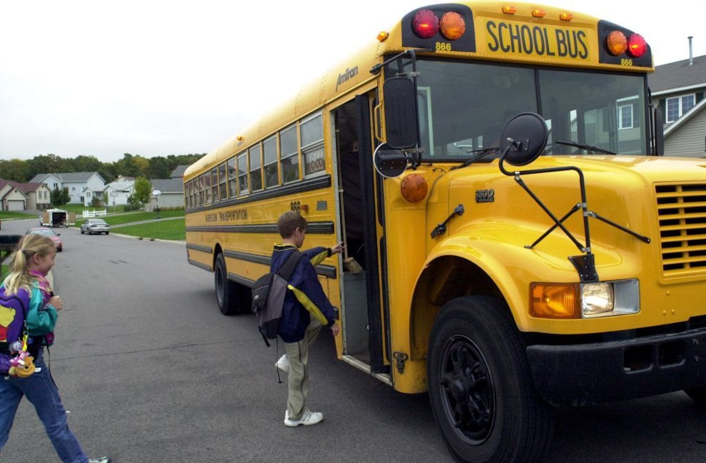 Students board the bus on their way to school. Lakeville Area Public Schools will introduce a fully electric bus for students to ride to and from school this year. ORG XMIT: MIN2017072514055639