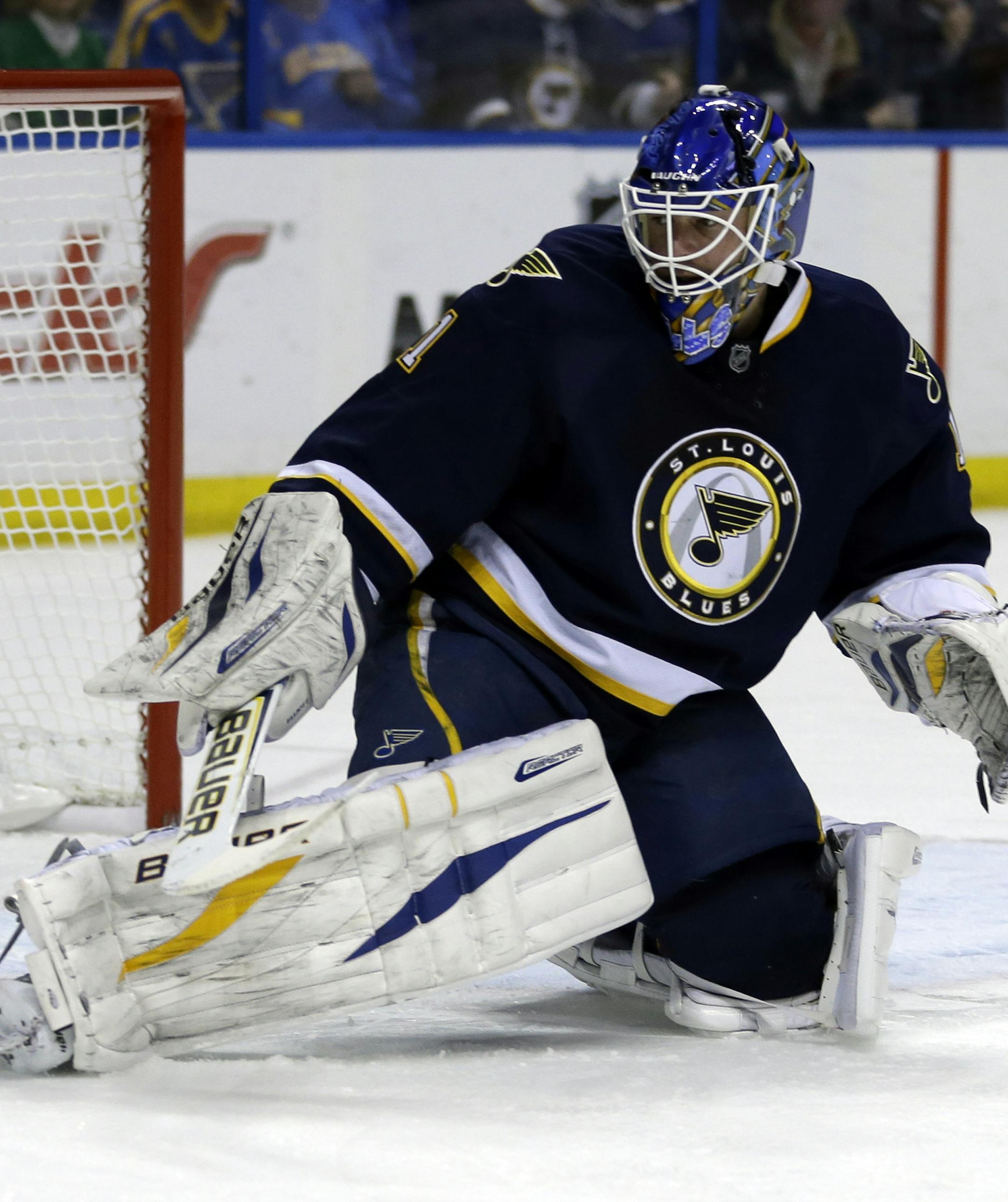 St. Louis Blues goalie Brian Elliott deflects a shot during the first period of an NHL hockey game against the Calgary Flames, Thursday, April 25, 2013, in St. Louis. (AP Photo/Jeff Roberson)