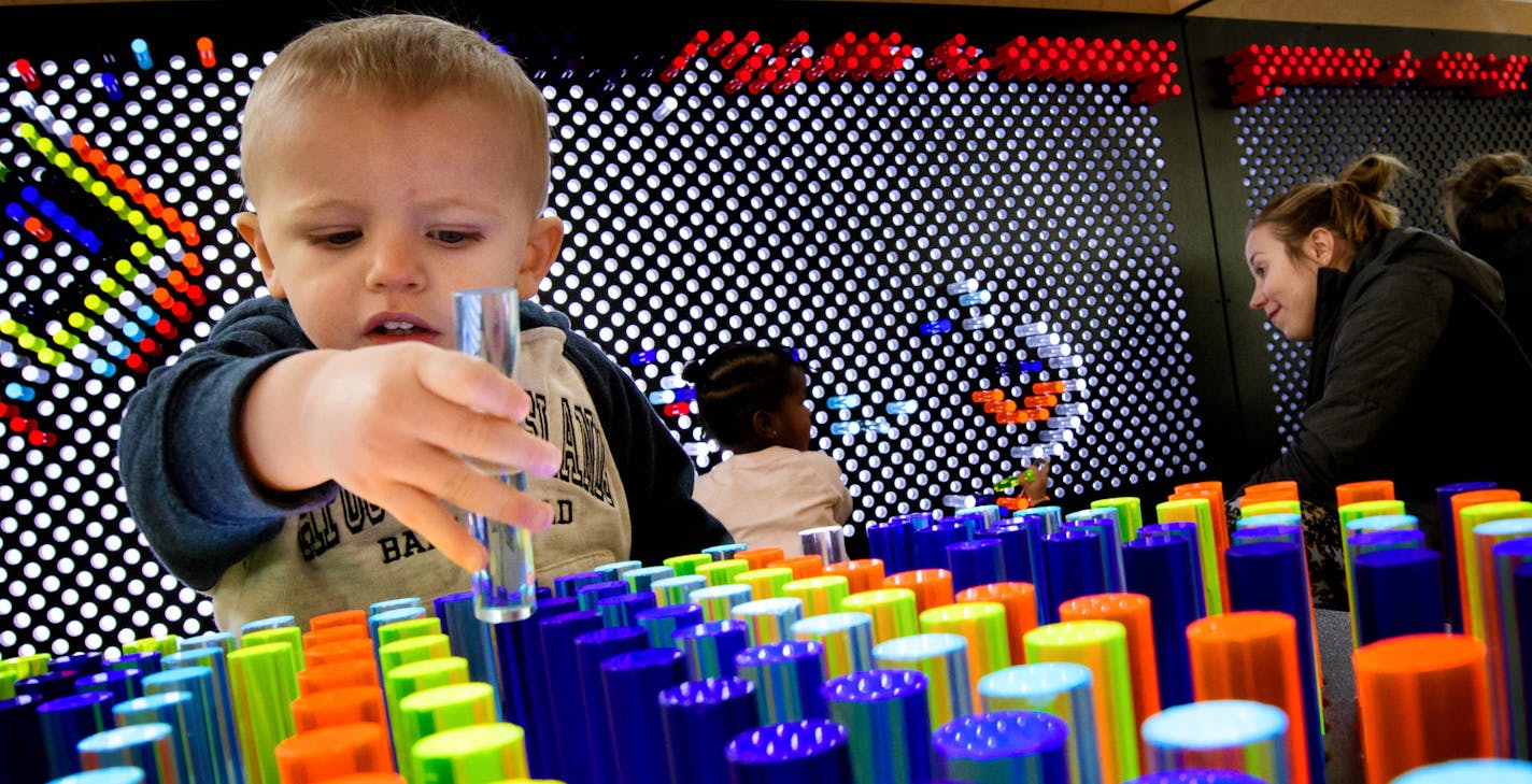 Kilik Lom, 2, played with the multicolor oversized light brite at the Brooklyn Park library. ] GLEN STUBBE * gstubbe@startribune.com Friday, January 13, 2017 The new Hennepin County library in Brooklyn Park.