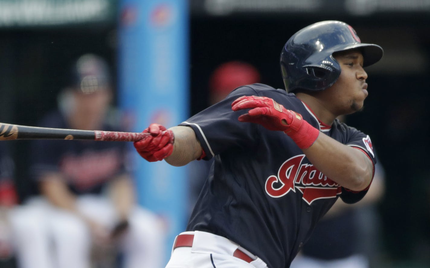 Cleveland Indians' Jose Ramirez watches his RBI-single off Los Angeles Angels starting pitcher Jaime Barria during the first inning of a baseball game Friday, Aug. 3, 2018, in Cleveland. (AP Photo/Tony Dejak)