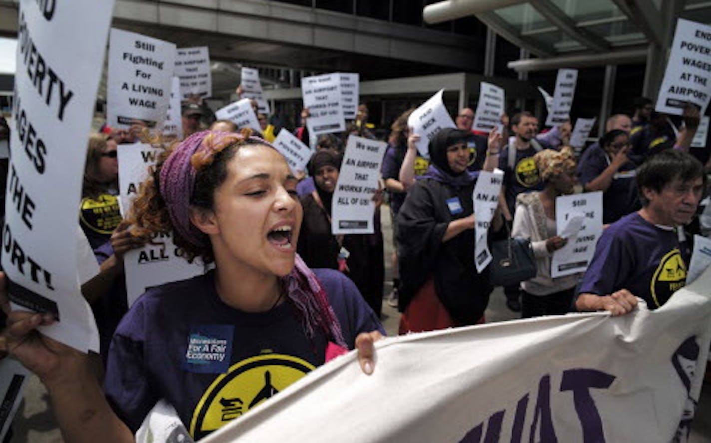 At the MSP airport on June 16, 2014, SEIU members and supporters demanded higher wages for the service workers that work there including Elsabet Binyam, far left .]richard.tsong-taatarii/rtsong-taatarii@startribune.com