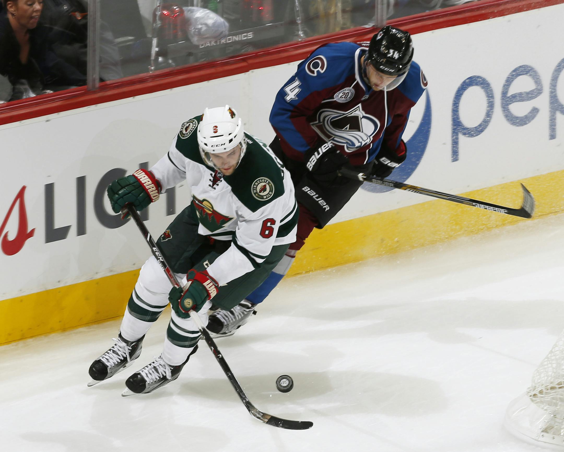 Minnesota Wild defenseman Marco Scandella (6) skates against Colorado Avalanche center Carl Soderberg (34) during the third period of an NHL hockey game Thursday, Oct. 8, 2015, in Denver. Minnesota beat Colorado 5-4. (AP Photo/Jack Dempsey)