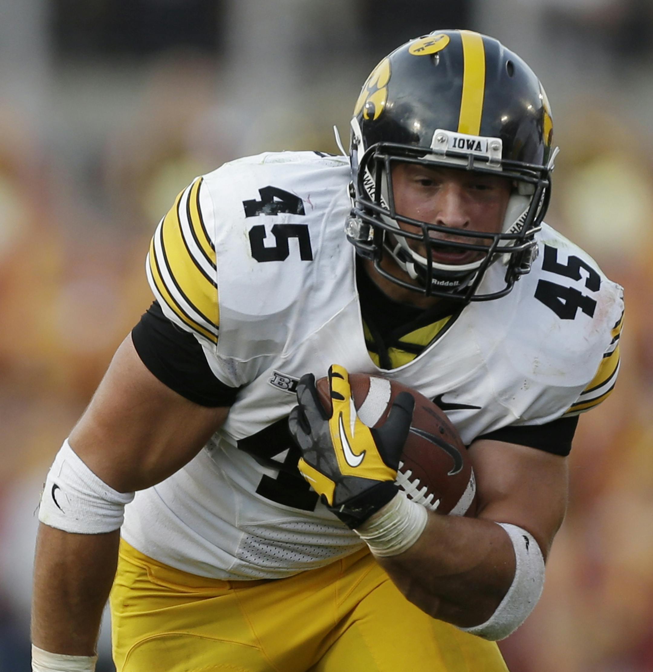 Iowa fullback Mark Weisman carries the ball during the first half of an NCAA college football game against Iowa State, Saturday, Sept. 14, 2013, in Ames, Iowa. (AP Photo/Charlie Neibergall) ORG XMIT: NYOTK