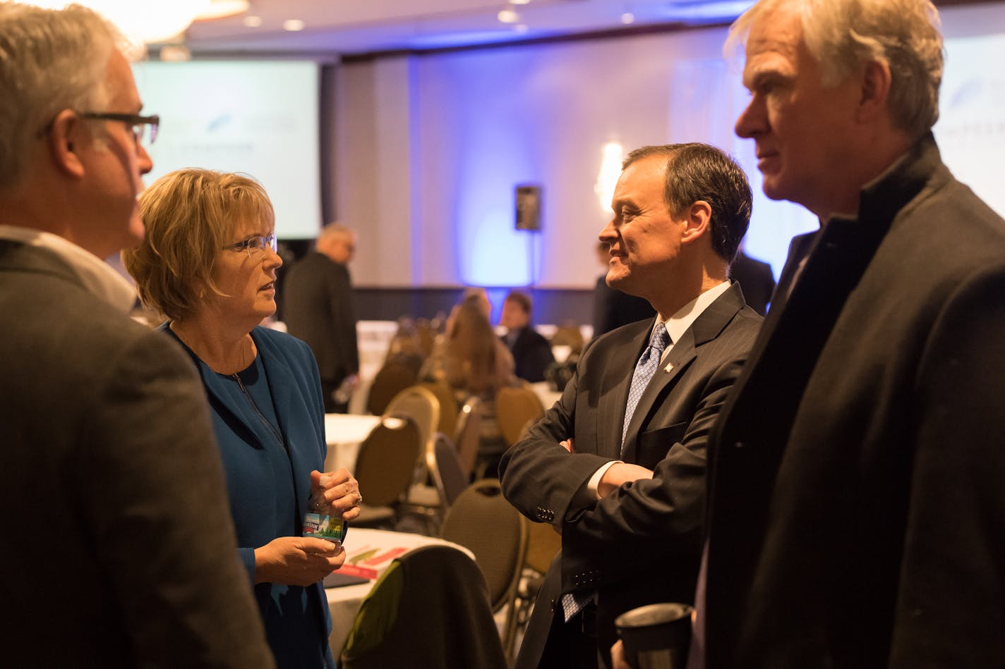 GOP candidates Woodbury Mayor Mary Guliani Stephens and Hennepin County Commissioner Jeff Johnson and DFL candidate Former St. Paul Mayor Chris Coleman. talked before the start of the conference. On the right is Reed Anfinson of the Center for Rural Development. ] GLEN STUBBE &#xef; glen.stubbe@startribune.com Friday, January 26, 2018 Minnesota candidates for governor gathered for a forum sponsored by the Center for Rural Policy and Development and the Minnesota Newspaper Association.