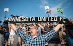 David Martin, of Prior Lake, held up his Minnesota United FC scarf during Wednesday night's game against the Jacksonville Armada. Martin has been a me