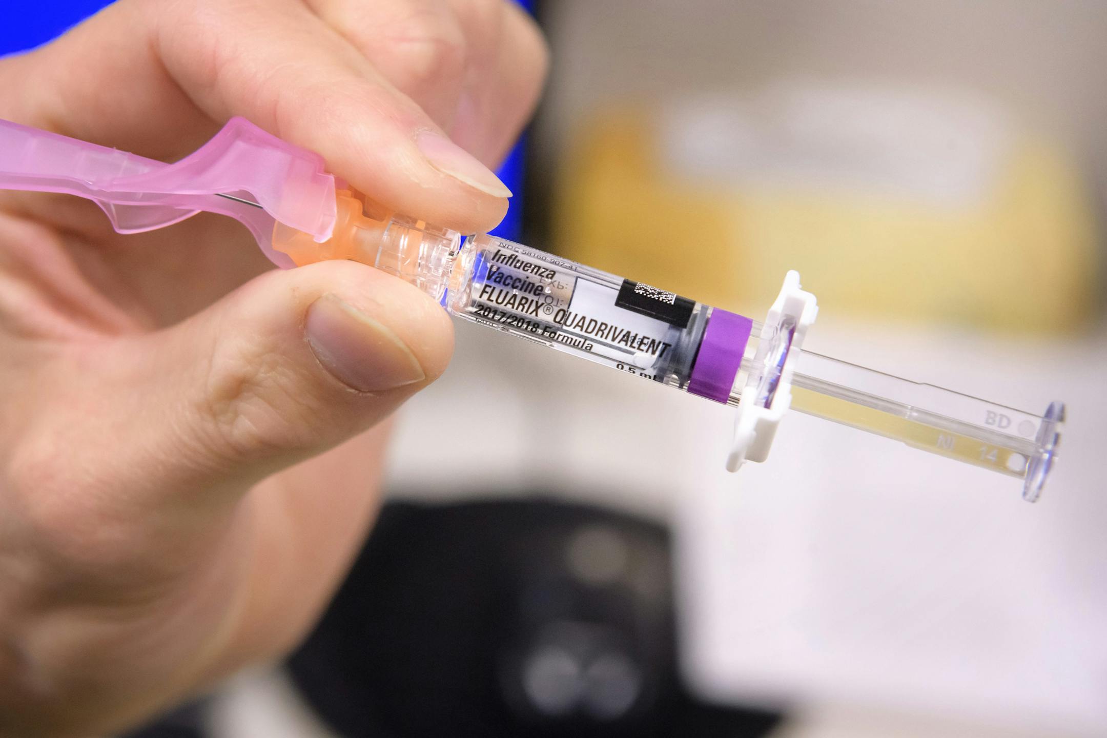 HCMC Chief Cardiologist Dr. Bart Bradley received a flu shot from Josh Gramling, head of employee occupational health at HCMC ] GLEN STUBBE ï glen.stubbe@startribune.com Wednesday, October 25, 2017 HCMC staff are asked to get flu shots and then display a black tag on their ID card to show they received it.
