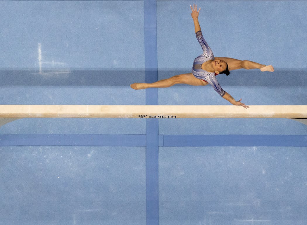 Suni Lee competes on the balance beam during the U.S. gymnastics Olympic trials at Target Center in Minneapolis on Sunday. 