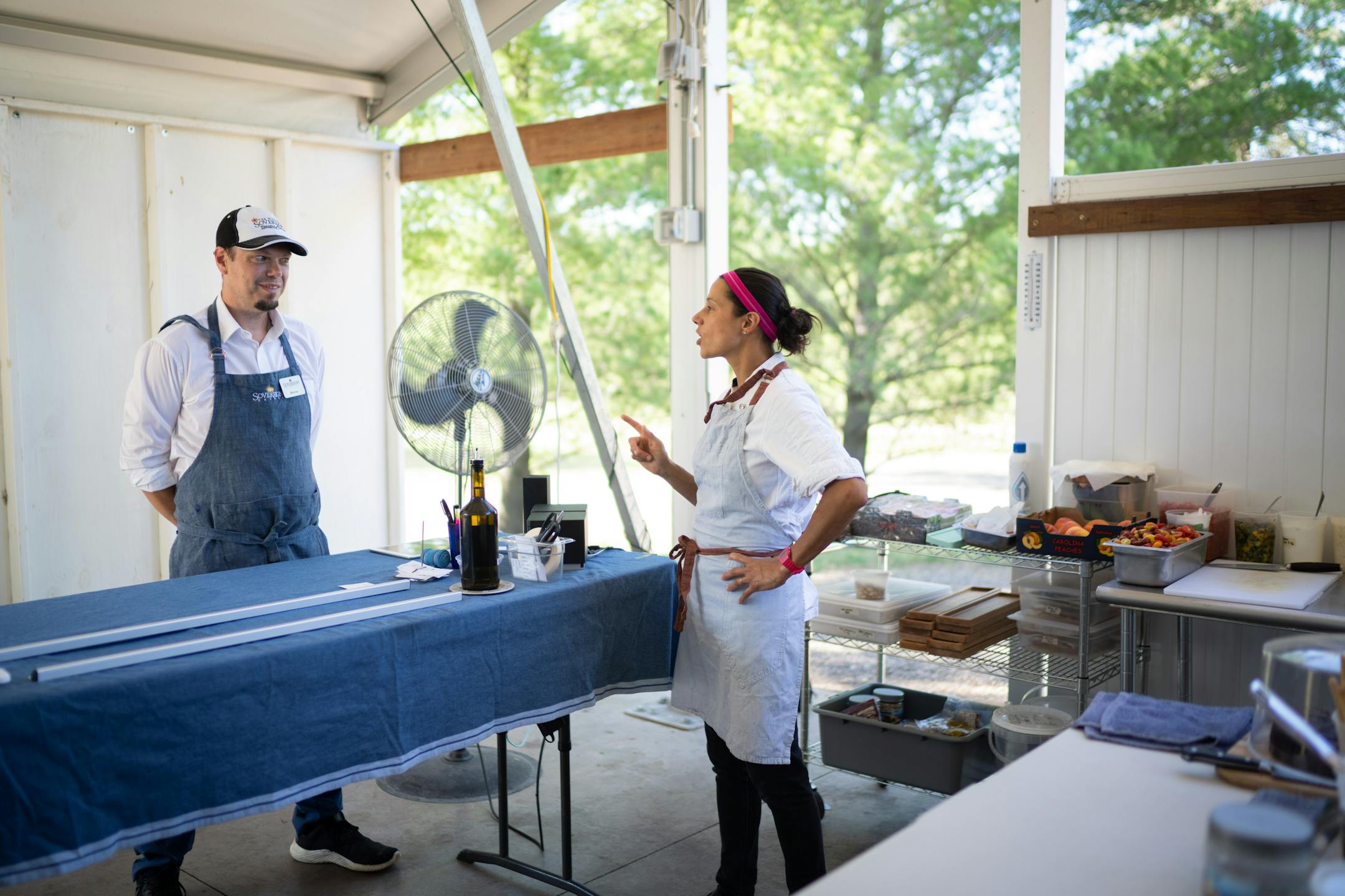 Chef Jo Seddon, right, chats with wine maker Ben Banks in the outdoor kitchen at Gia at the Lake.