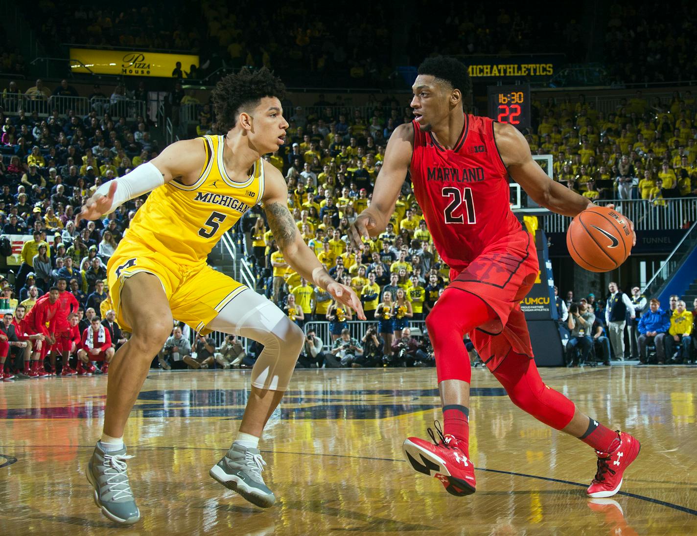 Michigan forward D.J. Wilson (5) defends Maryland forward Justin Jackson (21) in the first half of an NCAA college basketball game at Crisler Center in Ann Arbor, Mich., Saturday, Jan. 7, 2017. (AP Photo/Tony Ding)