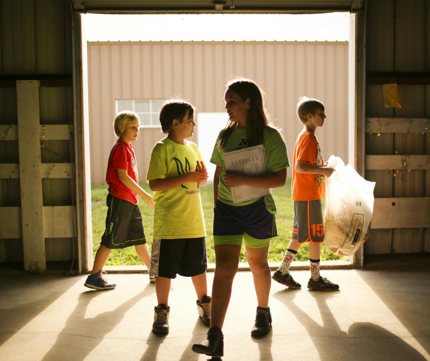 4-H'ers helped get the rabbit barn ready Monday evening at the Dakota County Fairgrounds in Farmington. ] JEFF WHEELER &#x2022; jeff.wheeler@startribune.com The Dakota County Fair begins August 10, but for 4-H'ers the event started Monday evening, August 3, 2015 as they were grilled by judges on just how well they know their swine, rabbits, and goats.